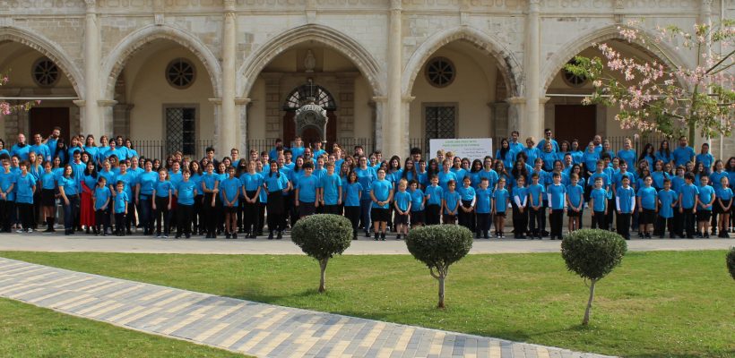 Staff and students stand together with our ‘Harry’s Day’ t-shirts in memory of Harry, an ex-student who passed away from cancer at the age of 21.<br><br>Thank you to everyone who bought a shirt and helped the Med High charity club raise funds for the Arodafnousa Hospice in Nicosia.