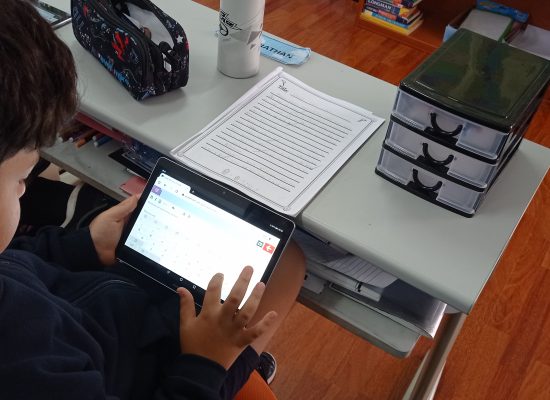 Junior School: ICT and ENGLISH <br>cross-curricular typing activity.<br><br>The Grade 4 students are typing their informational texts on tablets practising this way their basic word processing skills during the ICT lesson.